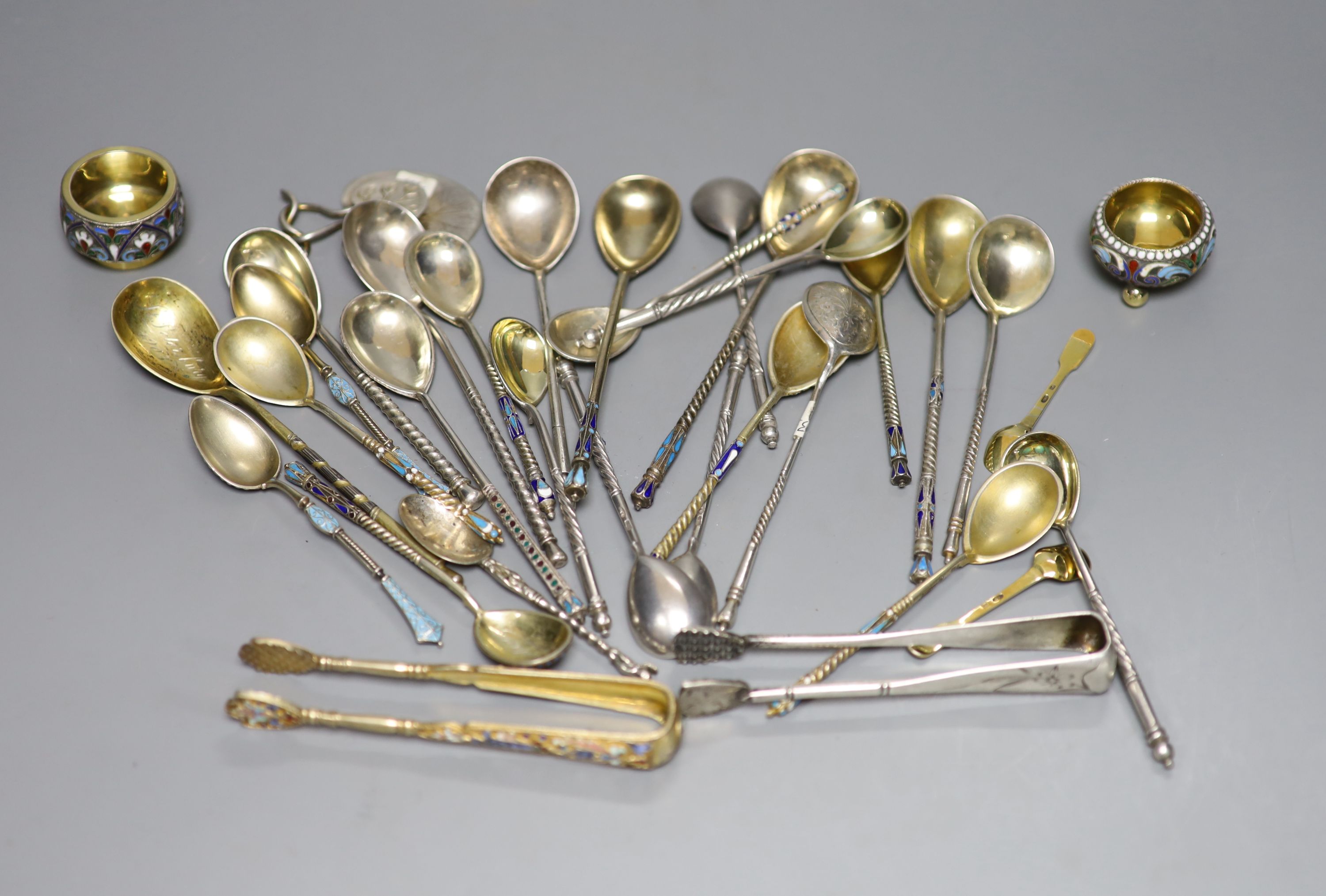 A small collection of Russian and Russian style white metal spoons etc, some with enamel or niello decoration.